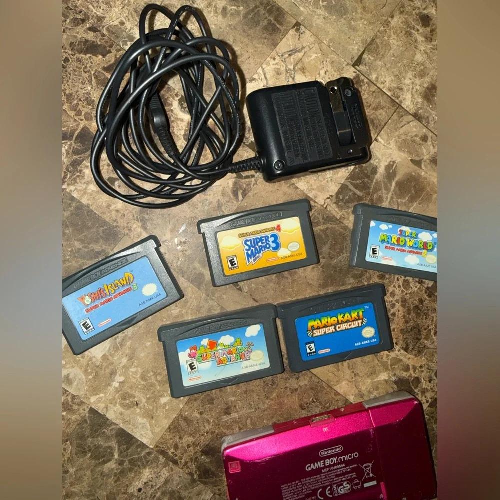 Pink Handheld Nintendo gameboy Micro with 5 games Mario Yoshi charger